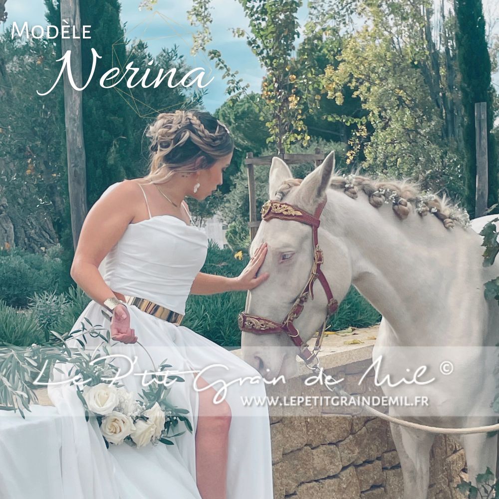 Le bustier Nerina, drapé et réalisé à la main, dévoile un large dos nu en vagues bénitier. Élégant et raffiné, il sublime la silhouette de chaque mariée.
